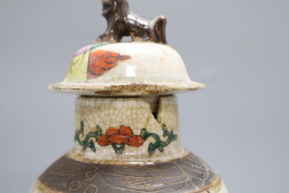 A Chinese famille rose crackleglaze vase and cover, together with a Chinese blue and white figural vase bearing Kangxi mark,